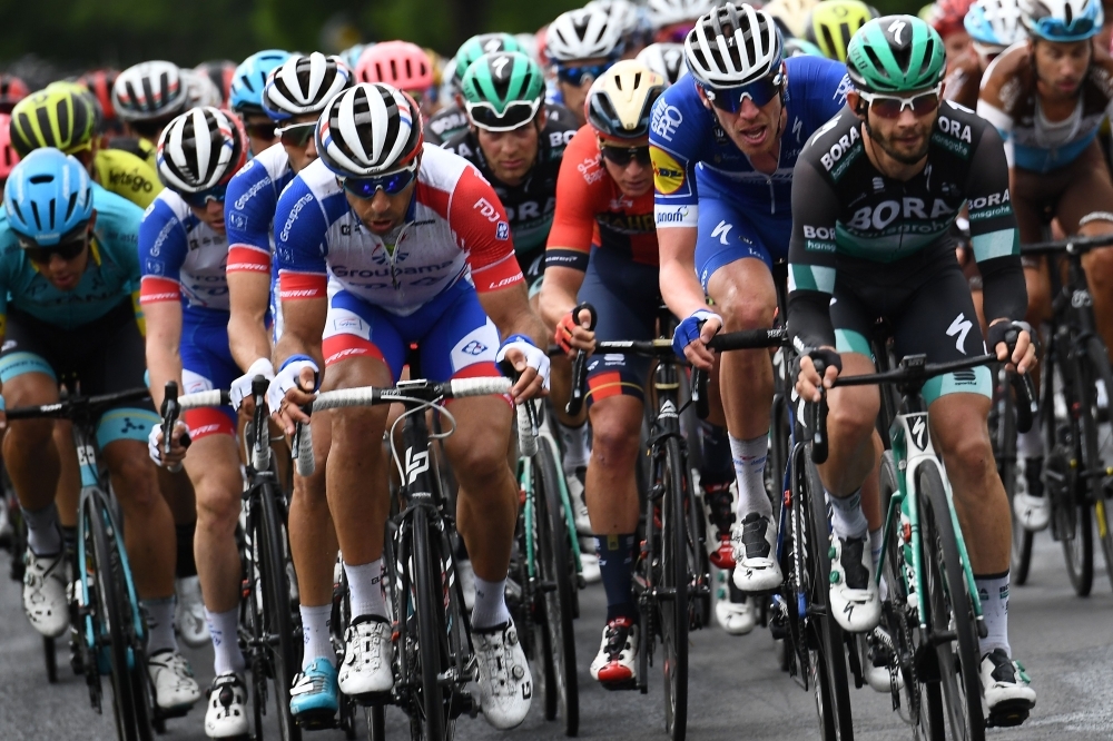 Team Dimension Data rider Norway's Edvald Boasson Hagen celebrates after he crossed the finish line to win the first stage of the 71st edition of the Criterium du Dauphine cycling race, 142 km between Aurillac and Jussac in Jussac on Sunday. — AFP
