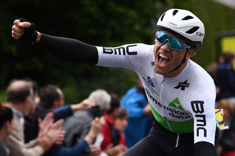 Team Dimension Data rider Norway's Edvald Boasson Hagen celebrates after he crossed the finish line to win the first stage of the 71st edition of the Criterium du Dauphine cycling race, 142 km between Aurillac and Jussac in Jussac on Sunday. — AFP