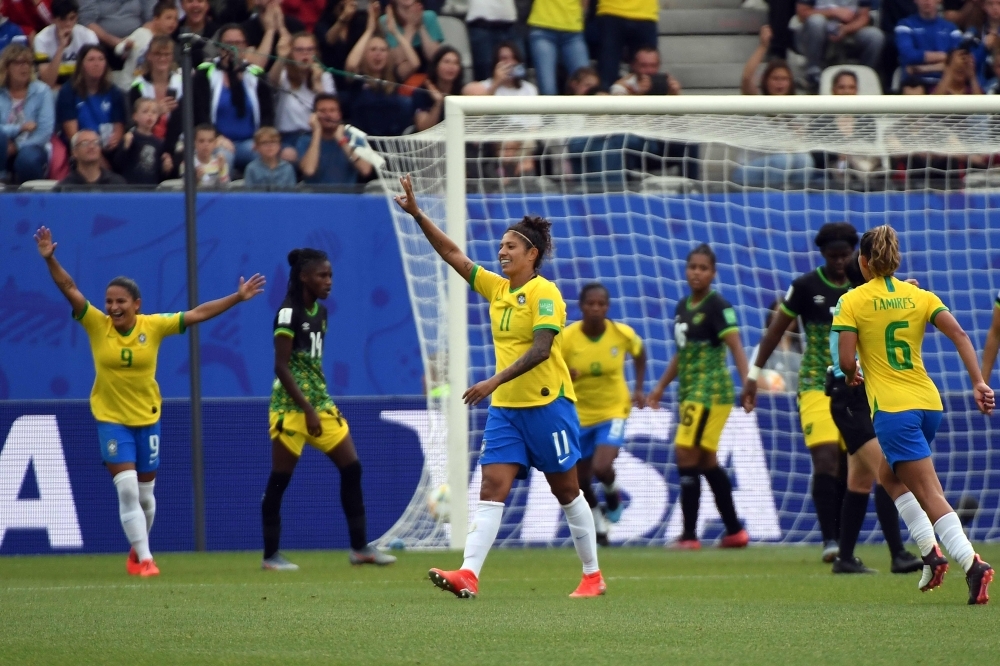 Brazil's forward Cristiane (C) celebrates after scoring a goal during the France 2019 Women's World Cup Group C football match against Jamaica on Sunday at the Alpes Stadium in Grenoble, central-eastern France. — AFP 