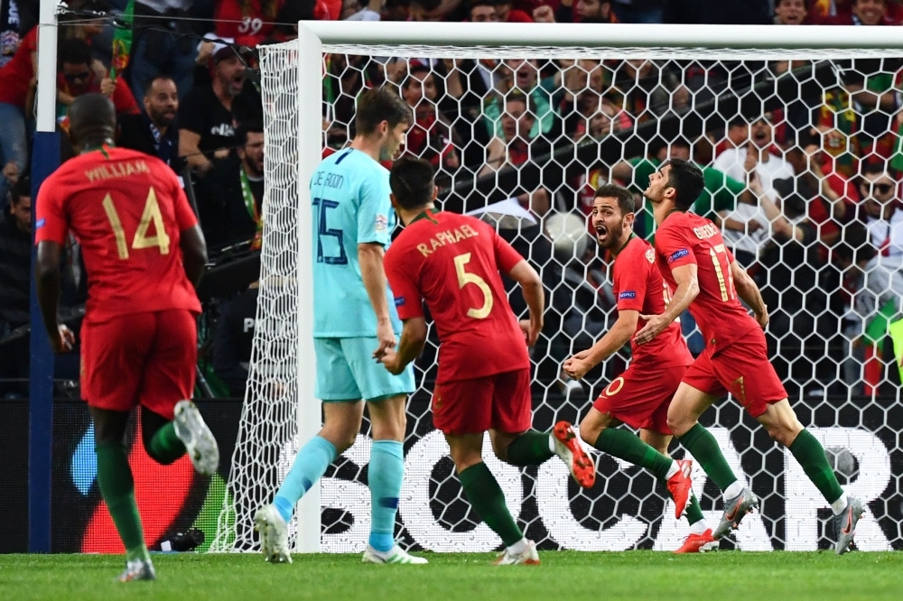 Portugal's Cristiano Ronaldo and teammates celebrate winning the UEFA Nations League Final with the trophy at the Estadio do Dragao, Porto, Portugal, on Sunday. — Reuters
