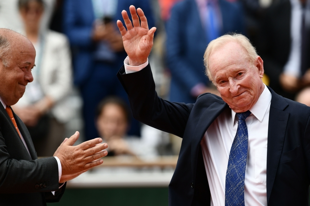 President of the French Tennis Federation (FFT) Bernard Giudicelli applauds Australia's tennis player Rod Laver during the podium ceremony at the end of the men's singles final match between Spain's Rafael Nadal and Austria's Dominic Thiem on day fifteen of The Roland Garros 2019 French Open tennis tournament in Paris on Sunday. — AFP