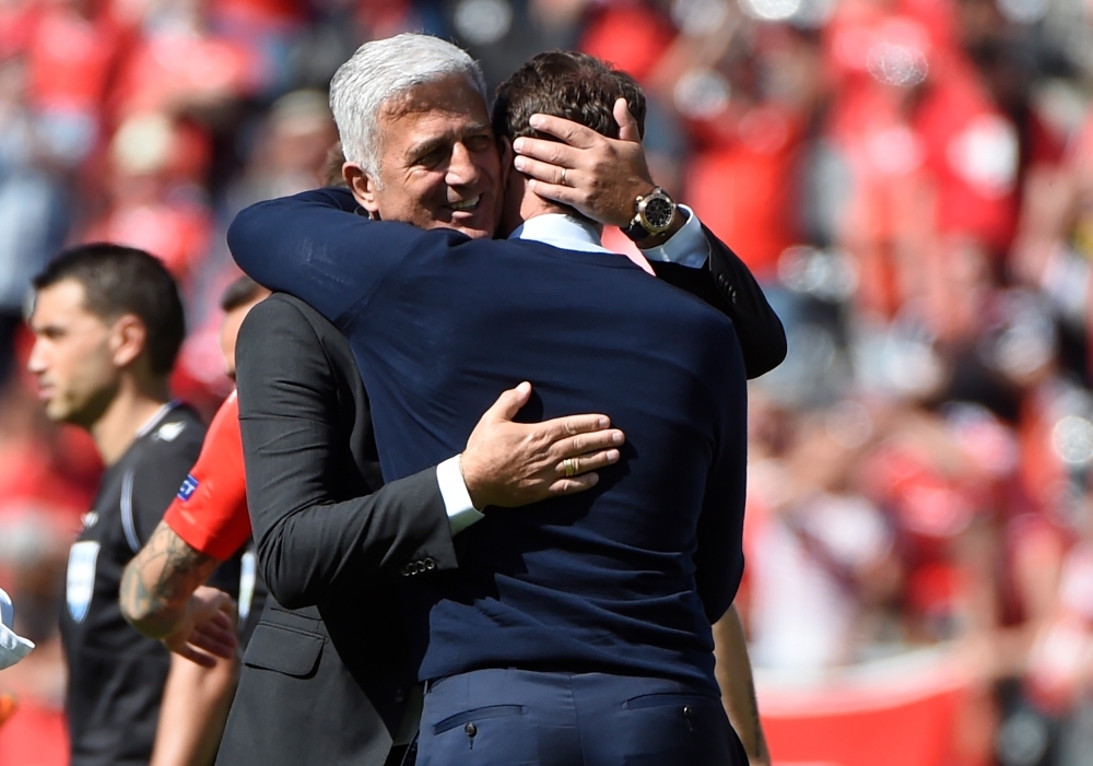 England's coach Gareth Southgate (R) celebrates their victory after the UEFA Nations League third place playoff football match against Switzerland at the Afonso Henriques Stadium in Guimaraes on Sunday. — AFP