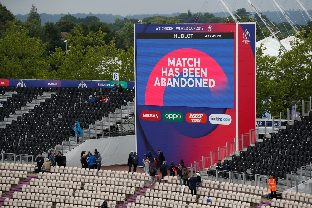 General view as the big screen displays a message notifying spectators the ICC Cricket World Cup match between South Africa and West Indies has been abandoned on Monday. — Reuters