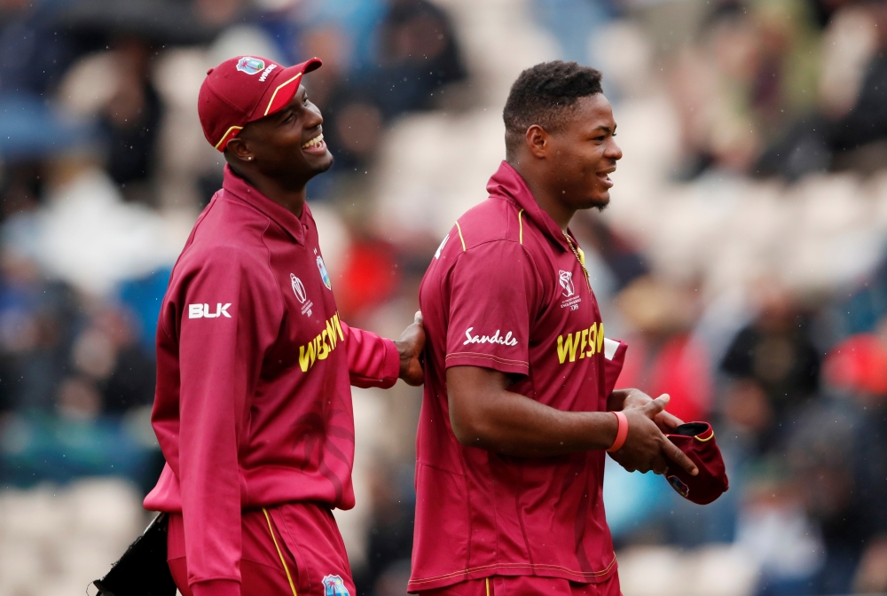 General view as the big screen displays a message notifying spectators the ICC Cricket World Cup match between South Africa and West Indies has been abandoned on Monday. — Reuters