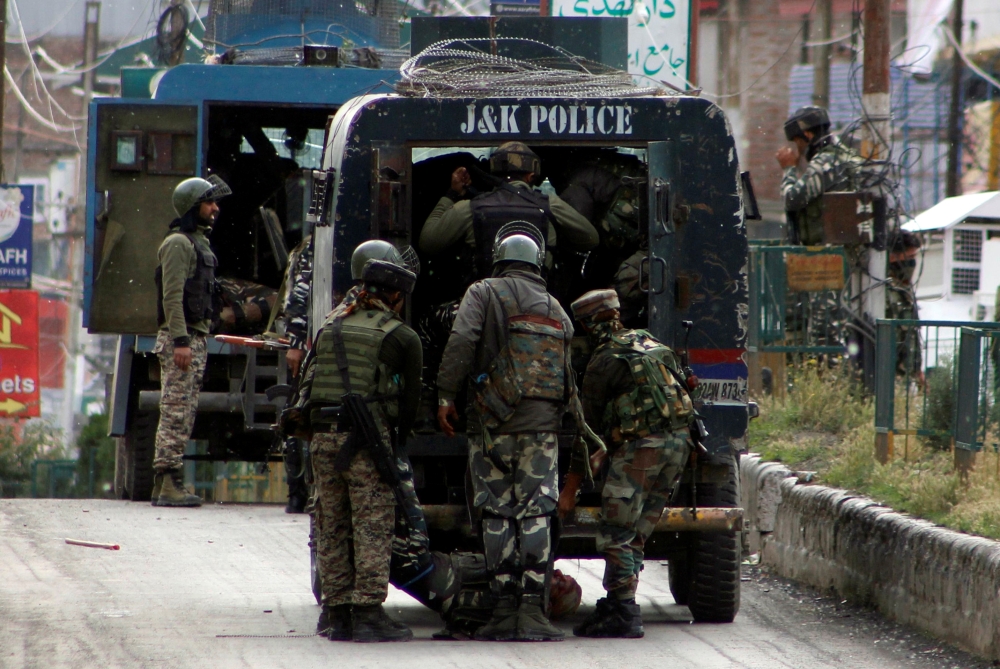 Members of the Indian Central Reserve Police Force carry the body of their colleague, who was killed in an attack by militants in south Kashmir's Anantnag district, on Wednesday. — Reuters