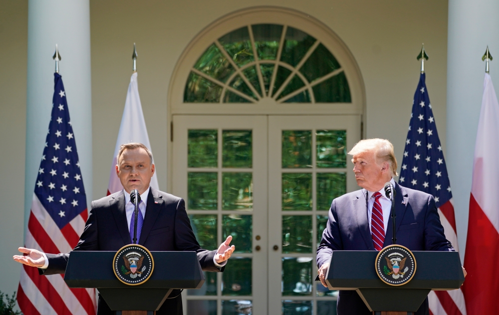 US President Donald Trump and Poland's President Andrzej Duda hold a joint news conference in the Rose Garden at the White House in Washington on Wednesday. — Reuters