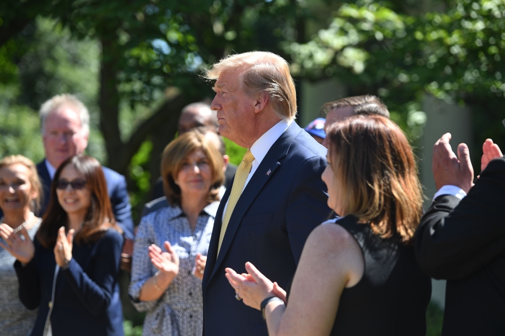 US President Donald Trump speaks during an event about expanding health coverage options for small businesses and workers in the Rose Garden of the White House in Washington, DC, Friday. — AFP