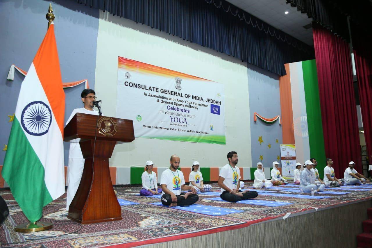 Dr. Ausaf Sayeed and Noor Rahman Sheikh pose with yoga enthusiasts. — Courtesy photos