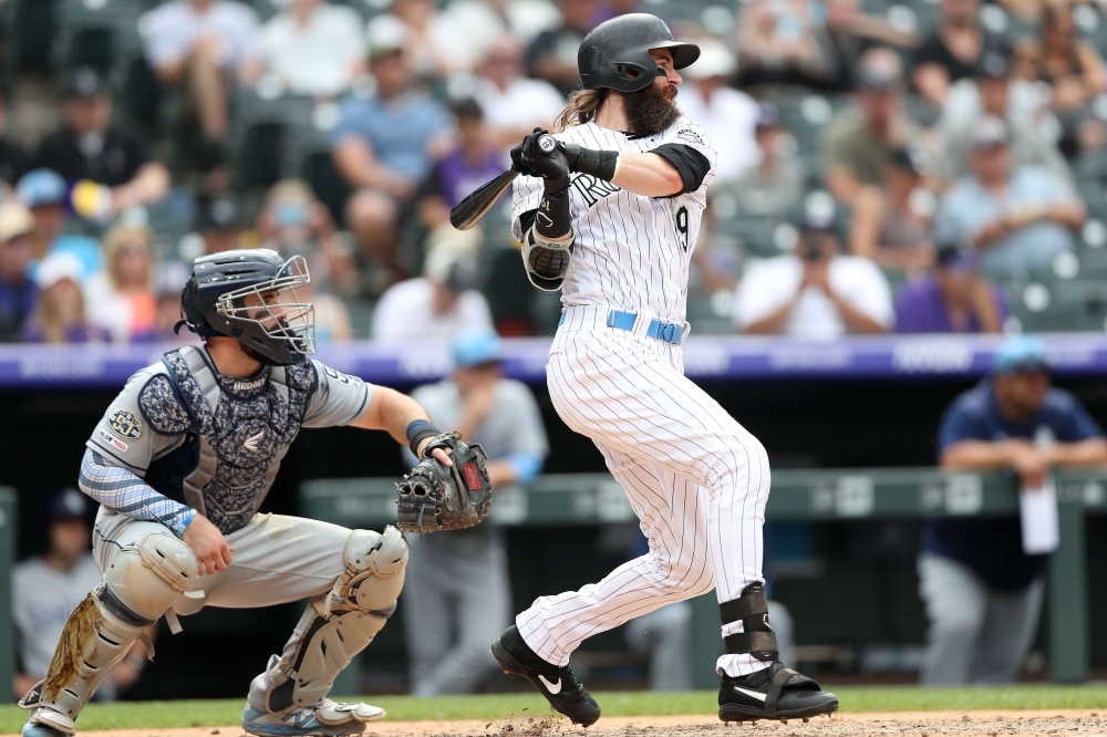 Charlie Blackmon No. 19 of the Colorado Rockies hits a RBI single in the sixth inning against the San Diego Padres at Coors Field on Sunday in Denver, Colorado. — AFP
