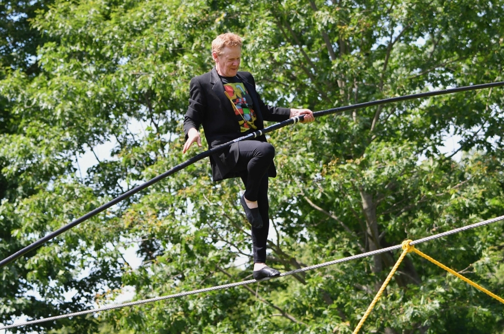 AGE NO BAR: French high wire artist Philippe Petit performs an aerial walk to launch the celebration of the 70th anniversary of Philip Johnson's Glass House at their summer party in New Canaan, Connecticut, in this June 9, 2019 file photo. — AFP