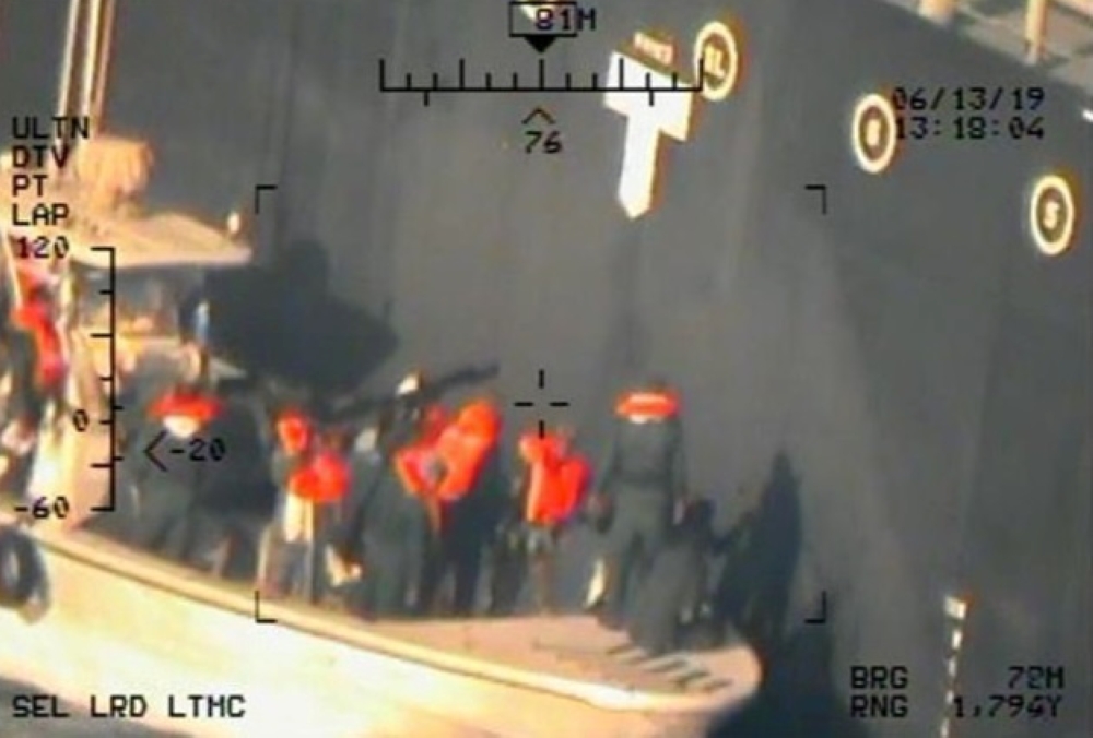 A US military image released by the Pentagon in Washington on Monday which it says was taken from a US Navy MH-60R helicopter in the Gulf of Oman in waters between Gulf Arab states and Iran on June 13, shows personnel that the Pentagon says are members of the Revolutionary Guard Corps Navy removing an unexploded limpet mine from the M/T Kokuka Courageous, a Japanese owned commercial motor tanker. — Reuters