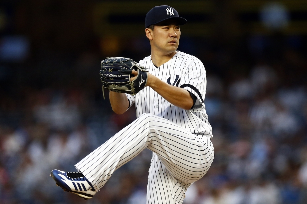 Masahiro Tanaka No. 19 of the New York Yankees pitches against the Tampa Bay Rays during the third inning at Yankee Stadium on Monday in the Bronx borough of New York City. — AFP