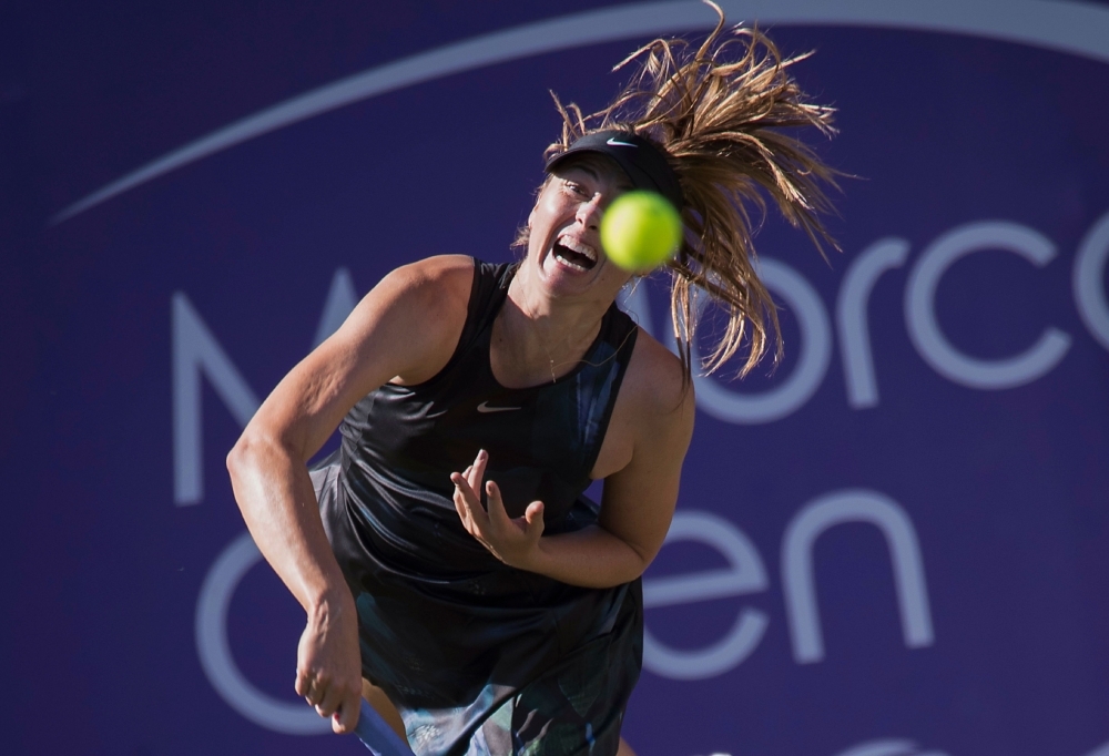 Russia's Maria Sharapova returns the ball to Slovakia's Viktoria Kuzmova during their women's singles match of the Mallorca Open tennis tournament in Santa Ponca on Tuesday. — AFP