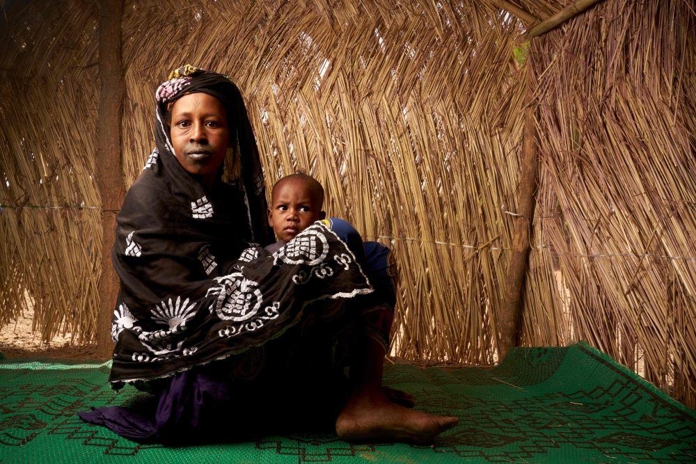 Fatouma Barry, 25, poses with her baby in a refugee camp in Bamako in this May 13, 2019 file photo. — AFP