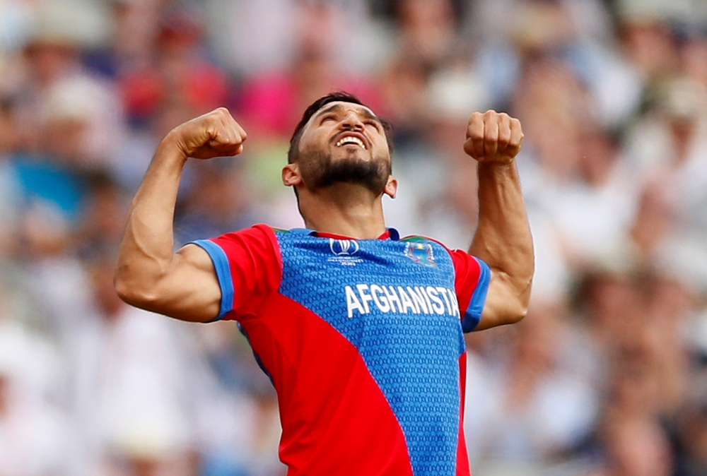 Afghanistan's Gulbadin Naib celebrates the wicket of England's Jonny Bairstow during the ICC Cricket World Cup match at the Old Trafford, Manchester, Britain, on Tuesday. — Reuters