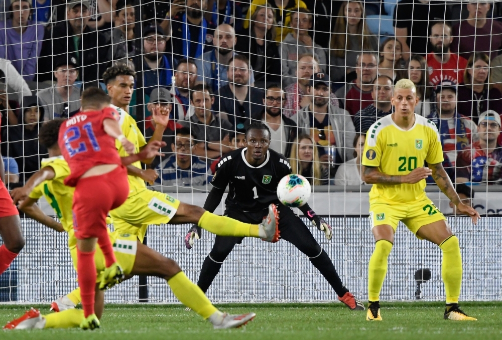 Akel Clarke No. 1 of Guyana watches the shot by Tyler Boyd No. 21 of the United States during the second half of the CONCACAF Gold Cup match at Allianz Field on Tuesday in St Paul, Minnesota. Boyd scored a goal on the play as the United States defeated Guyana 4-0.  — AFP