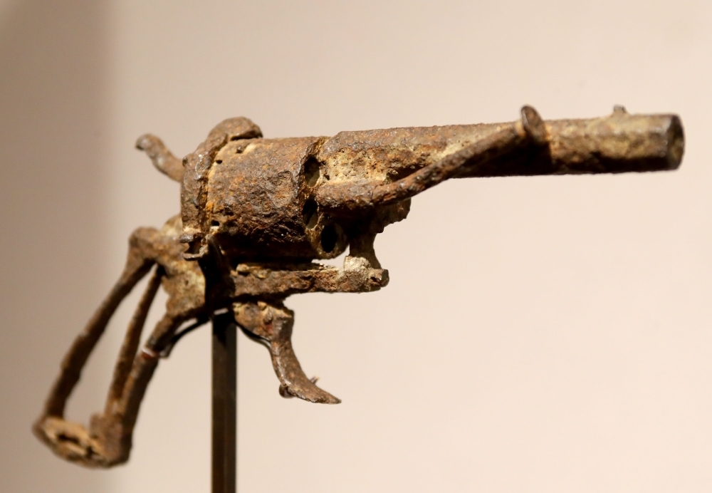 A revolver believed to be the gun Dutch 19th century painter Vincent Van Gogh used to kill himself on 27 July 1890 is on public display at Paris' Drouot auction house. — AFP