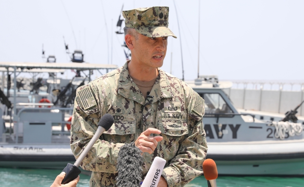Commander Sean Kido, Commanding Officer of Task Group 56.1, speaks during a press briefing at a UAE Naval facility near the port of Fujairah on Wednesday about the attack on the Japanese-owned Kokuka Courageous oil tanker in the Gulf of Oman last week. — AFP 