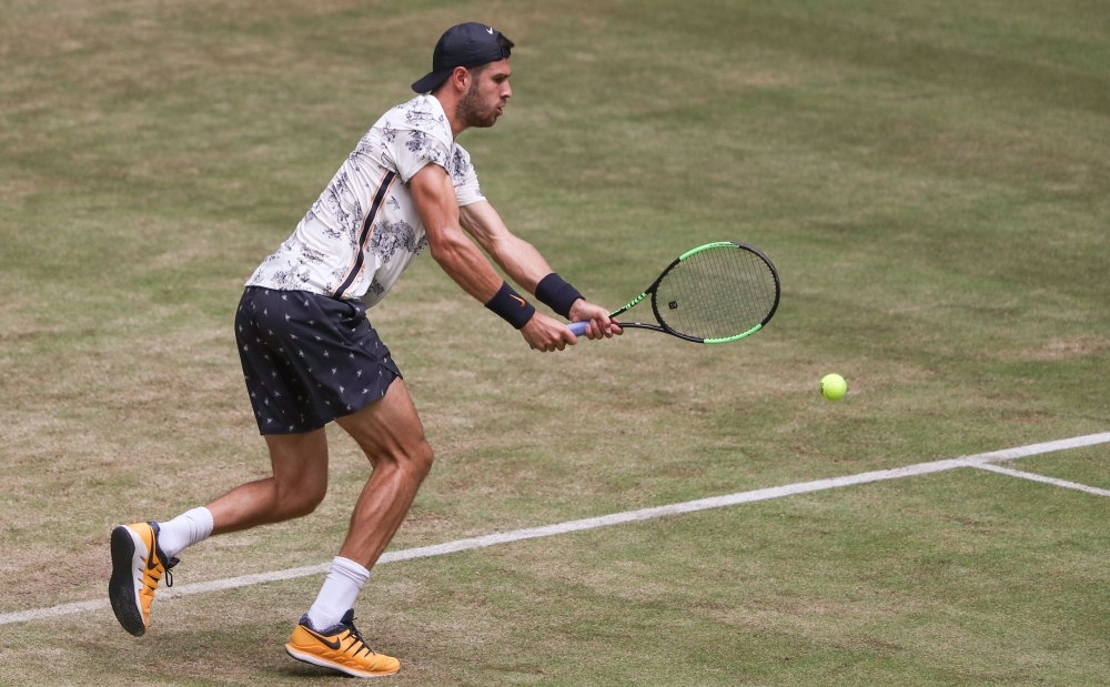 Russia's Karen Khachanov returns the ball to Germany's Jan-Lennard Struff during their tennis match at the ATP Open tennis tournament in Halle, western Germany, on Wednesday. — AFP