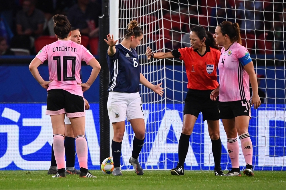 Scotland's coach Michelle Kerr comforts players at the end of the France 2019 Women's World Cup Group D football match between Scotland and Argentina, on Wednesday, at the Parc des Princes stadium in Paris. —  AFP