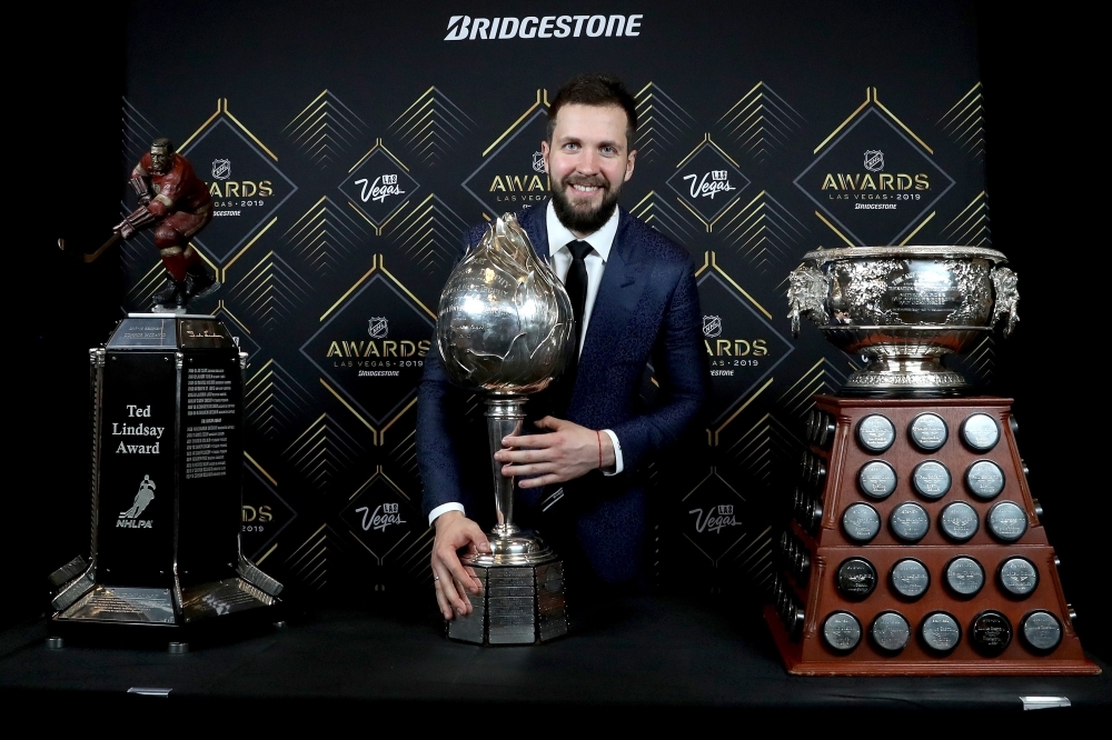 Nikita Kucherov of the Tampa Bay Lightning poses with the Ted Lindsay Award, the Hart Memorial Trophy and the Art Ross Trophy during the 2019 NHL Awards at the Mandalay Bay Events Center on Wednesday in Las Vegas, Nevada. — AFP