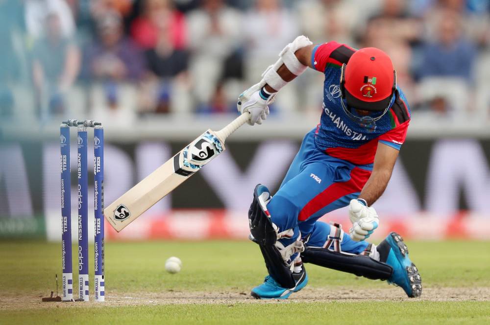 Afghanistan's Hashmatullah Shahidi is hit on the head off a ball from England's Mark Wood during the ICC Cricket World Cup match at Old Trafford, Manchester, Britain on Tuesday. — Reuters