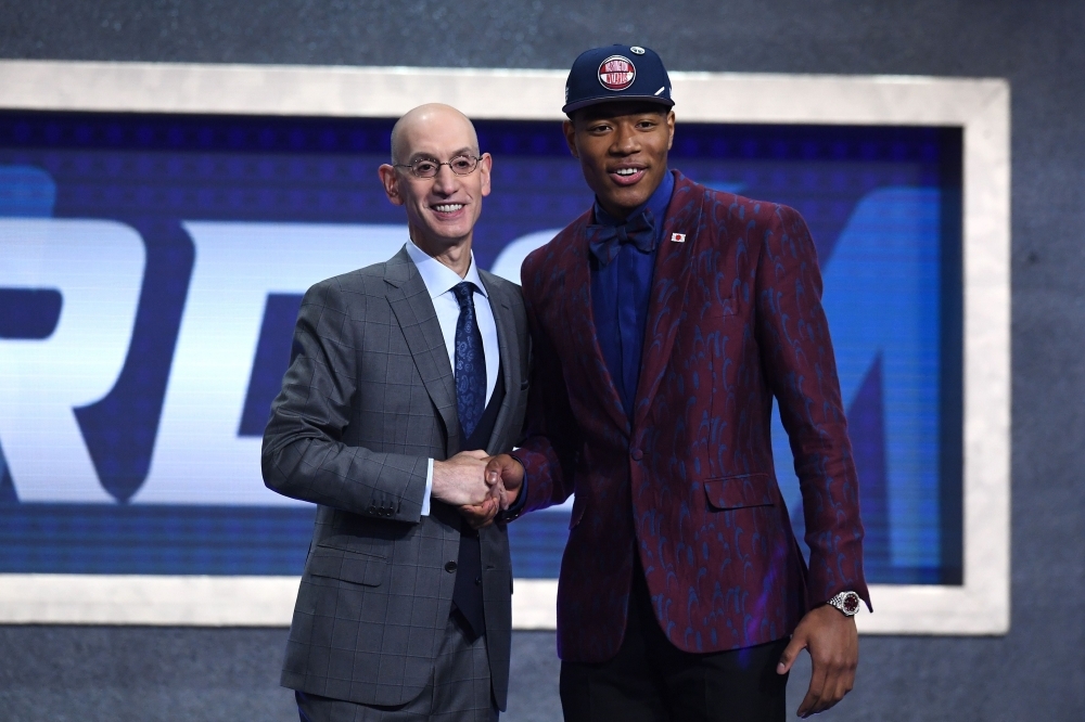 Rui Hachimura poses with NBA Commissioner Adam Silver after being drafted with the ninth overall pick by the Washington Wizards during the 2019 NBA Draft at the Barclays Center on Thursday in the Brooklyn borough of New York City. — AFP