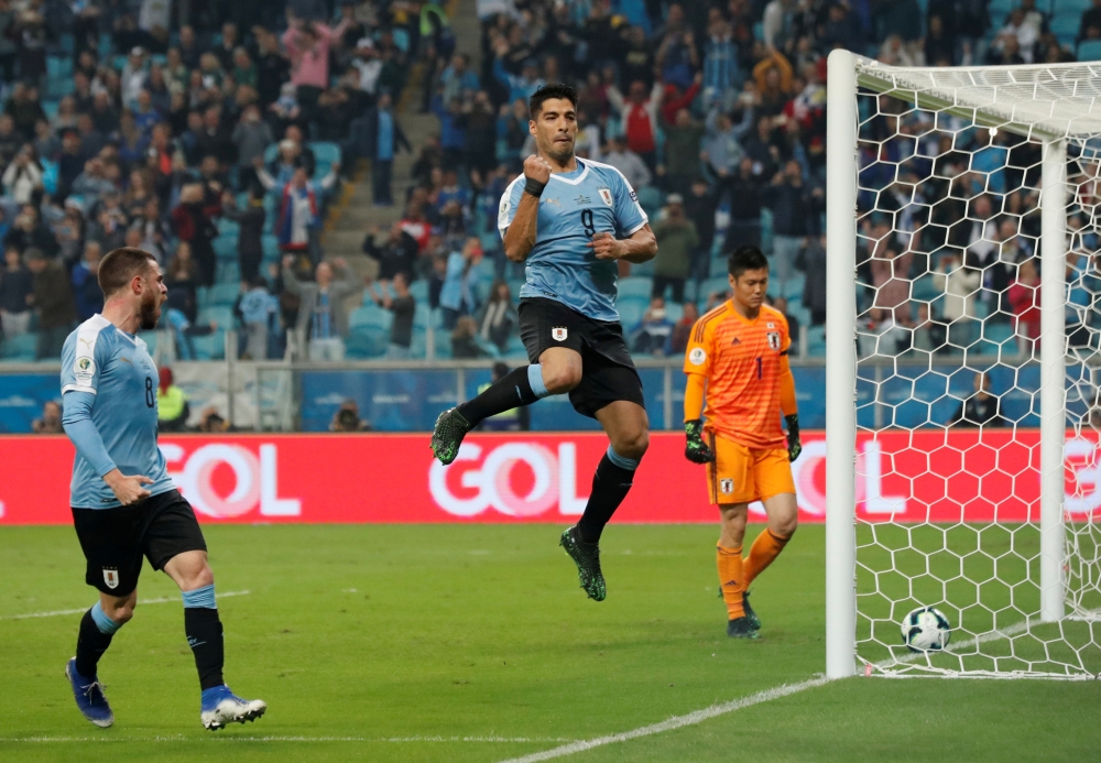 Japan's Ko Itakura in action with Uruguay's Giorgian de Arrascaeta during the Copa America Brazil 2019 Group C match at the Arena Do Gremio, Porto Alegre, Brazil. — Reuters