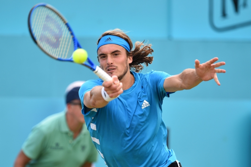 Canada's Felix Auger Aliassime returns to Greece's Stefanos Tsitsipas during their men's singles quarter final tennis match at the ATP Fever-Tree Championships tournament at Queen's Club in west London on Friday. — AFP