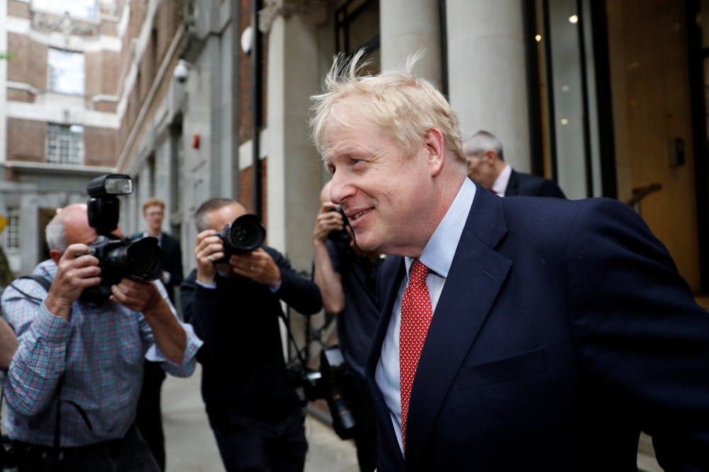 Boris Johnson, leadership candidate for Britain's Conservative prime minister, leaves a hustings event in London, Friday. — Reuters
