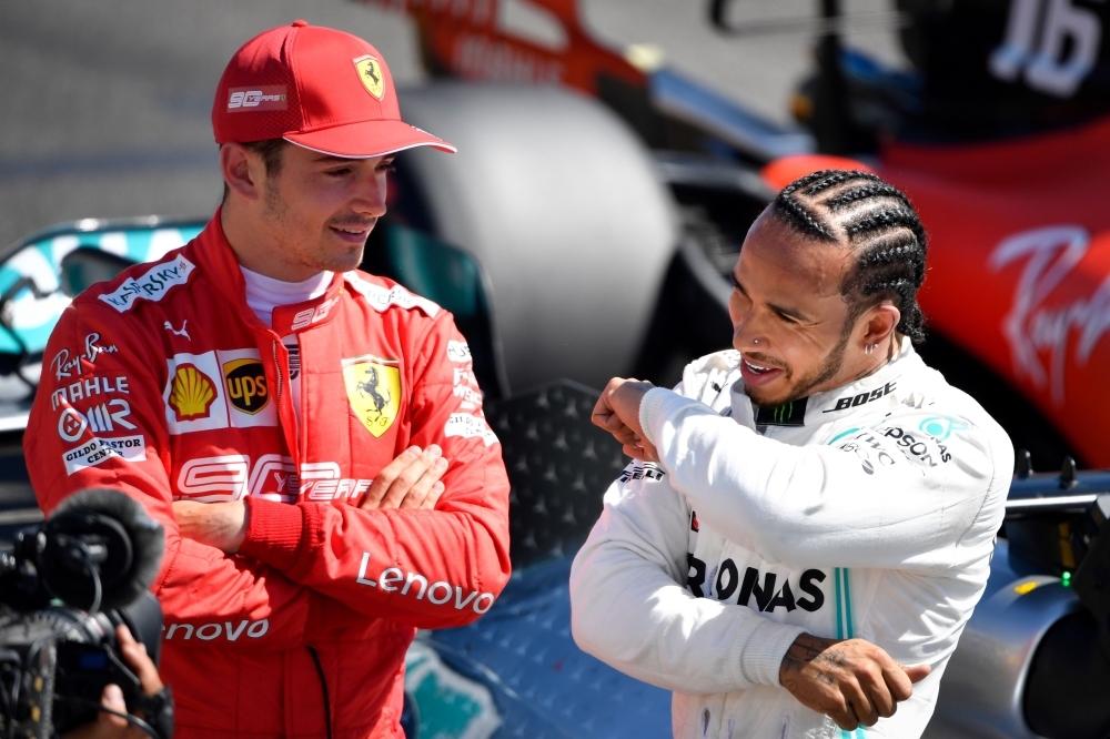 (LtoR) Third placed Ferrari's Monegasque driver Charles Leclerc, Pole position winner Mercedes' British driver Lewis Hamilton and second placed Mercedes' Finnish driver Valtteri Bottas pose after the qualifying session at the Circuit Paul Ricard in Le Castellet, southern France, on Saturday ahead of the Formula One Grand Prix de France. – AFP