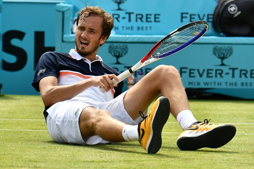 France's Gilles Simon keeps his eyes on the ball as he returns against Russia's Daniil Medvedev in their men's singles semifinal tennis match at the ATP Fever-Tree Championships tournament at Queen's Club in west London on Saturday. — AFP