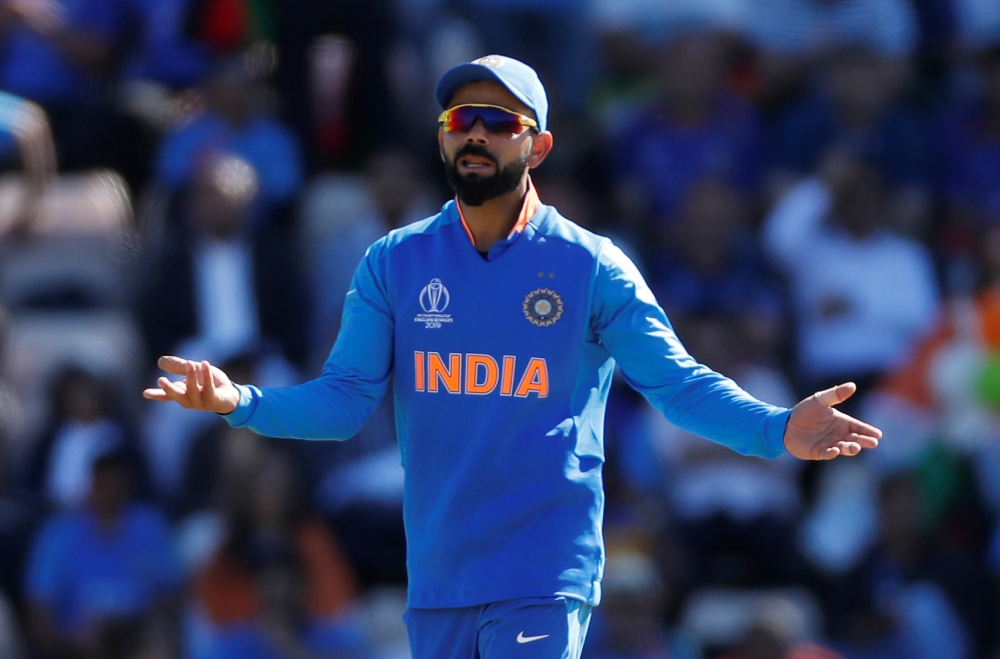 India's skipper Virat Kohli talks to umpire Richard Illingworth during the ICC Cricket World Cup match against Afghanistan at The Ageas Bowl, Southampton, Britain, on Saturday. — Reuters