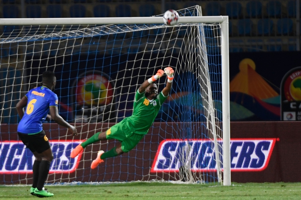 Tanzania's goalkeeper Aishi Manula punches the ball away during the 2019 Africa Cup of Nations (CAN) football match against Senegal at the 30 June Stadium in Cairo on Sunday.  — AFP