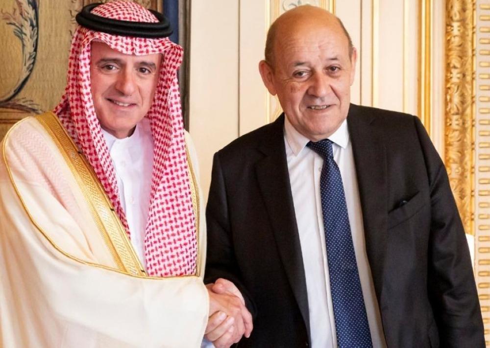 Minister of State for Foreign Affairs Adel Al-Jubeir with French Foreign Minister Jean-Yves Le Drian in Paris on Sunday. — SPA