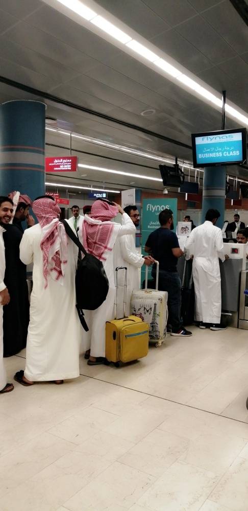 Passengers waiting at the check-in counter at Abha airport which is operating normally Monday, a day after a Houthi attack in which a Syrian national was killed and 21 others were injured. — Okaz photo