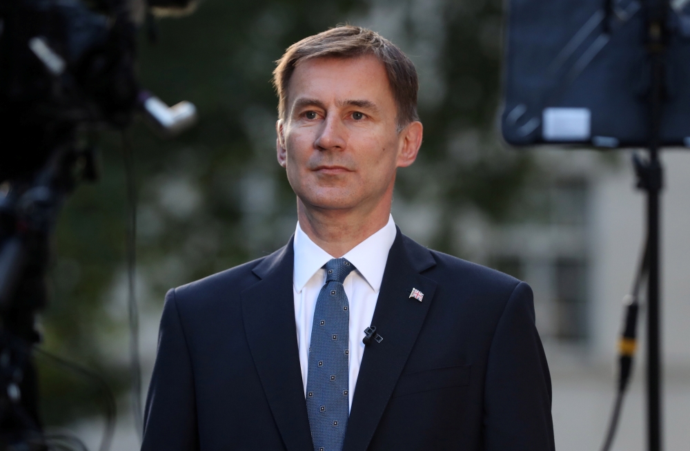 Conservative Party leadership candidate Jeremy Hunt attends an interview outside his home in London on Monday. — Reuters