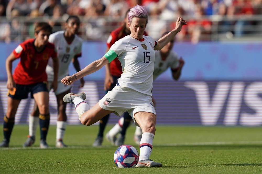 United States' forward Megan Rapinoe (L) and United States' midfielder Sam Mewis celebrate at the end of the France 2019 Women's World Cup round of sixteen football match against Spain on Monday, at the Auguste-Delaune stadium in Reims, northern France. — AFP 