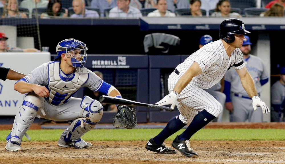 New York Yankees left fielder Brett Gardner (11) gets an RBI on a fielders choice against the Toronto Blue Jays during the sixth inning at Yankee Stadium. — Reuters