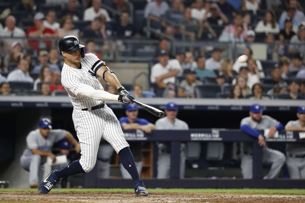 New York Yankees left fielder Brett Gardner (11) gets an RBI on a fielders choice against the Toronto Blue Jays during the sixth inning at Yankee Stadium. — Reuters