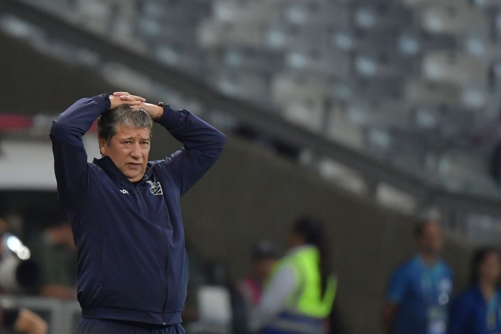 Ecuador's coach Colombian Hernan Dario Gomez reacts during their Copa America football tournament group match against Japan at the Mineirao Stadium in Belo Horizonte, Brazil, on Monday. — AFP