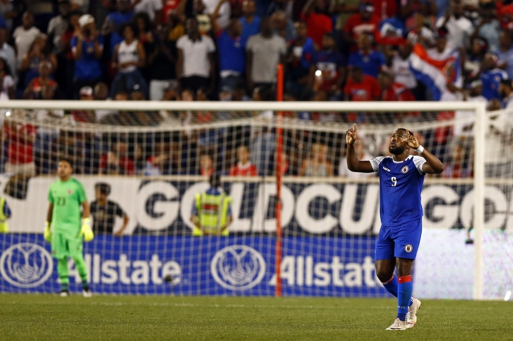 Duckens Nazon No. 9 of Haiti celebrates after scoring a goal past Leonel Moreira No. 23 of Costa Rica during the second half of a CONCACAF Gold Cup soccer match at Red Bull Arena on Monday in Harrison, N.J.  — AFP
== FOR NEWSPAPERS, INTERNET, TELCOS & TELEVISION USE ONLY ==