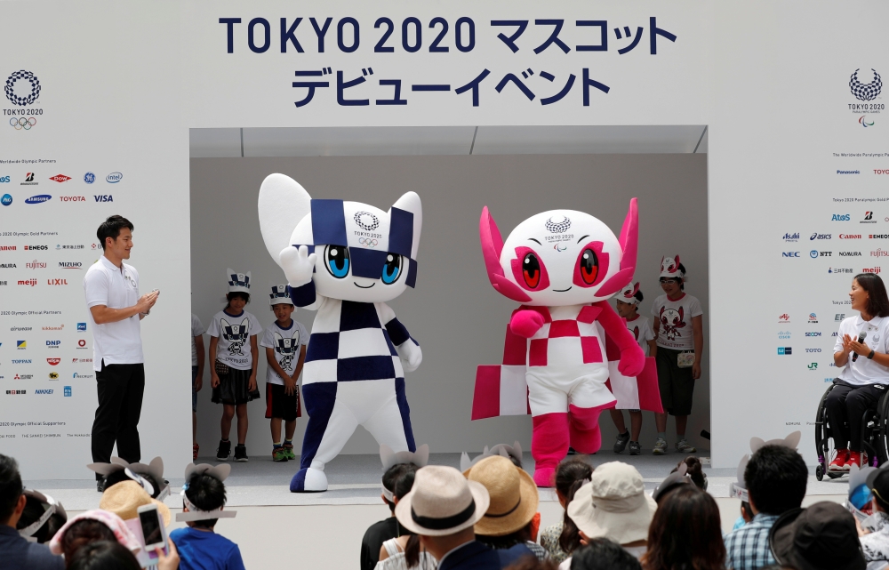 Tokyo 2020 Olympic Games mascot Miraitowa holds the torch of the Tokyo 2020 Olympic Games during a Torch Relay event to mark the 300-day milestone to the starting date of the torch relay, in Tokyo, Japan in this June 1, 2019, photo. — Reuters