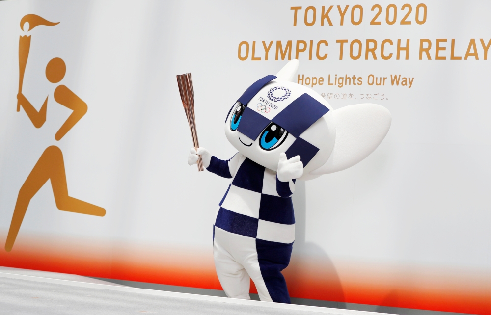 Tokyo 2020 Olympic Games mascot Miraitowa holds the torch of the Tokyo 2020 Olympic Games during a Torch Relay event to mark the 300-day milestone to the starting date of the torch relay, in Tokyo, Japan in this June 1, 2019, photo. — Reuters