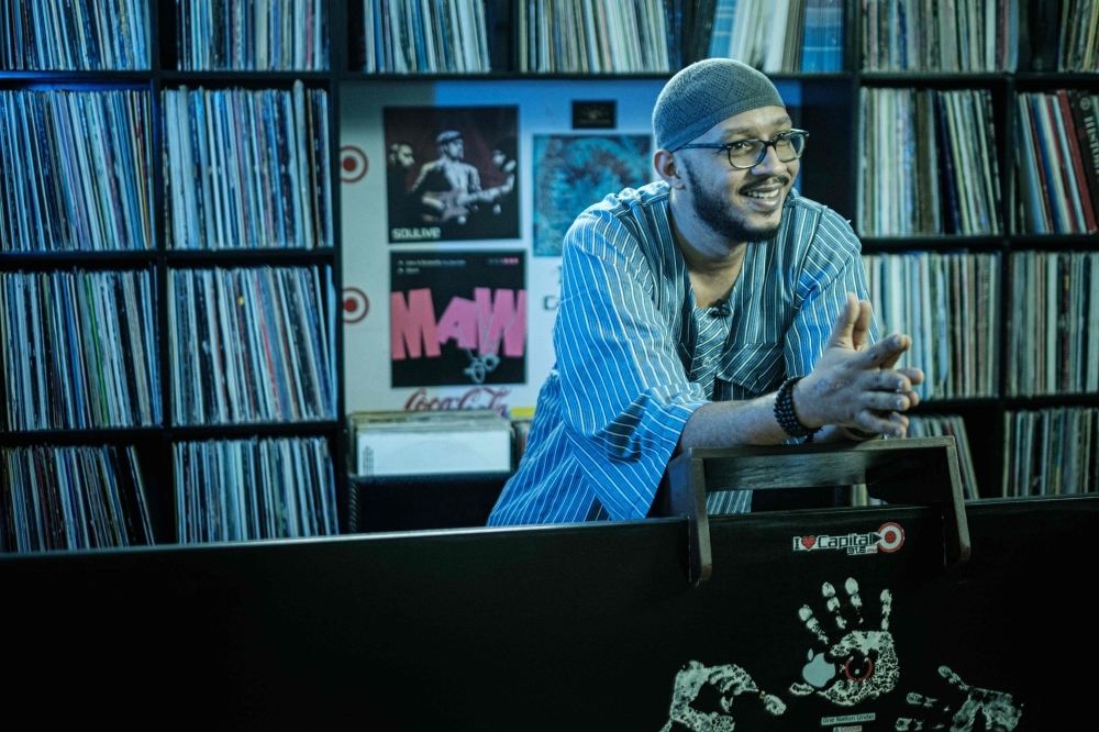 Sudanese music producer and guitarist Amjad Badr plays the guitar at Sudanese English-language Capital Radio in Khartoum. A surge of freedom has taken over Sudan's underground music scene since the army ousted longtime ruler Omar Al-Bashir in April after months of nationwide protests against his rule. From rap to afrobeat, musicians living in Sudan and overseas have composed tunes punctuated by some of the protest movement's most popular slogans. — AFP photos