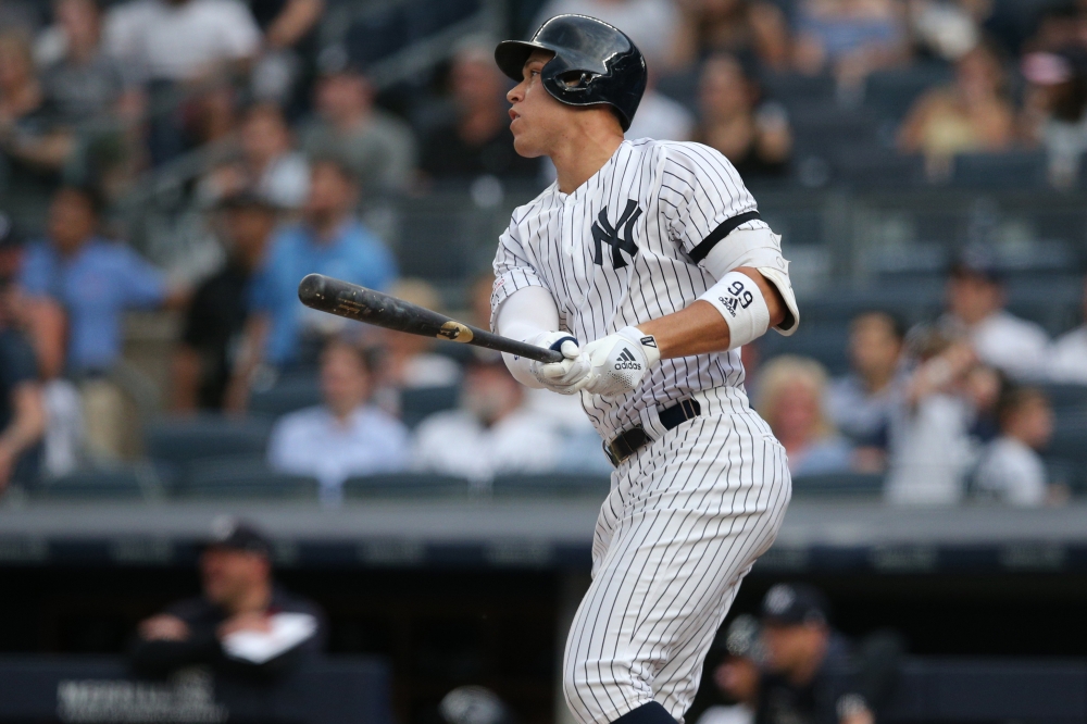 New York Yankees designated hitter Edwin Encarnacion (30) follows through on a solo home run against the Toronto Blue Jays during the eighth inning at Yankee Stadium. — Reuters