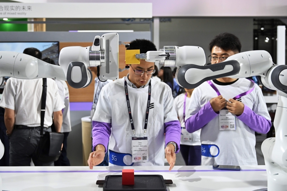 Robots are seen in the Ericsson stand during the Mobile World Congress (MWC 2019) introducing next-generation technology at the Shanghai New International Expo Centre (SNIEC) in Shanghai on Wednesday. — AFP