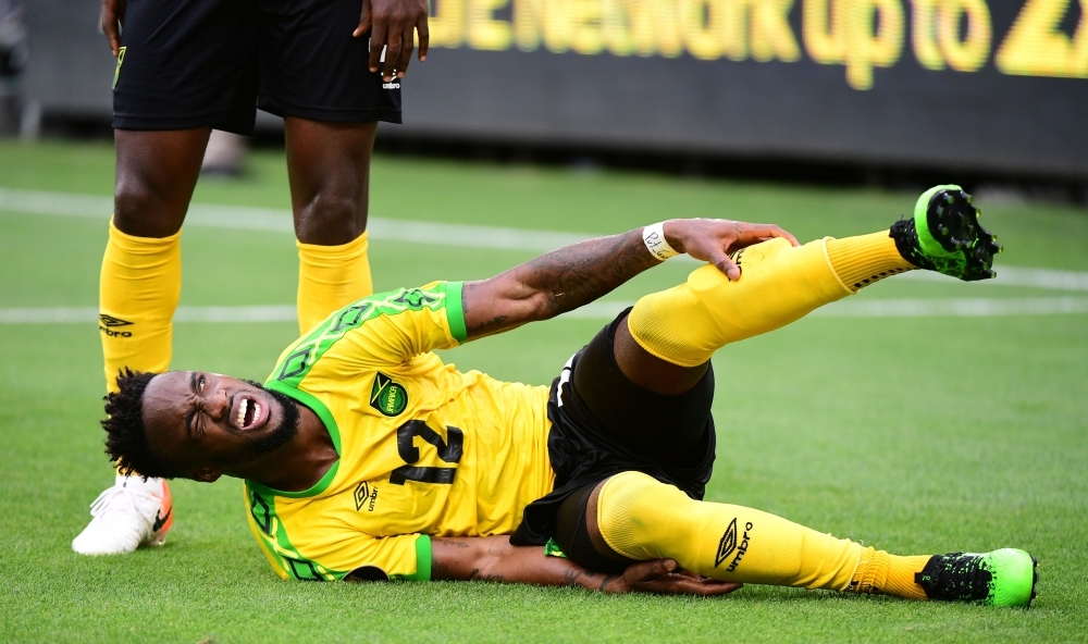 Jamaica's Junior Flemmings reacts to an injury during the Group B Concacaf Gold Cup first round football match between Jamaica and Curacao in Los Angeles on Tuesday. — AFP 