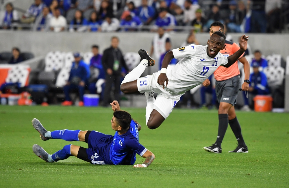 Honduras forward Alberth Elis (17) collides with El Salvador defender Ivan Mancia (4) in the second half during group play in the CONCACAF Gold Cup soccer tournament at Banc of California Stadium. Honduras defeated El Salvador 4-0. — Reuters