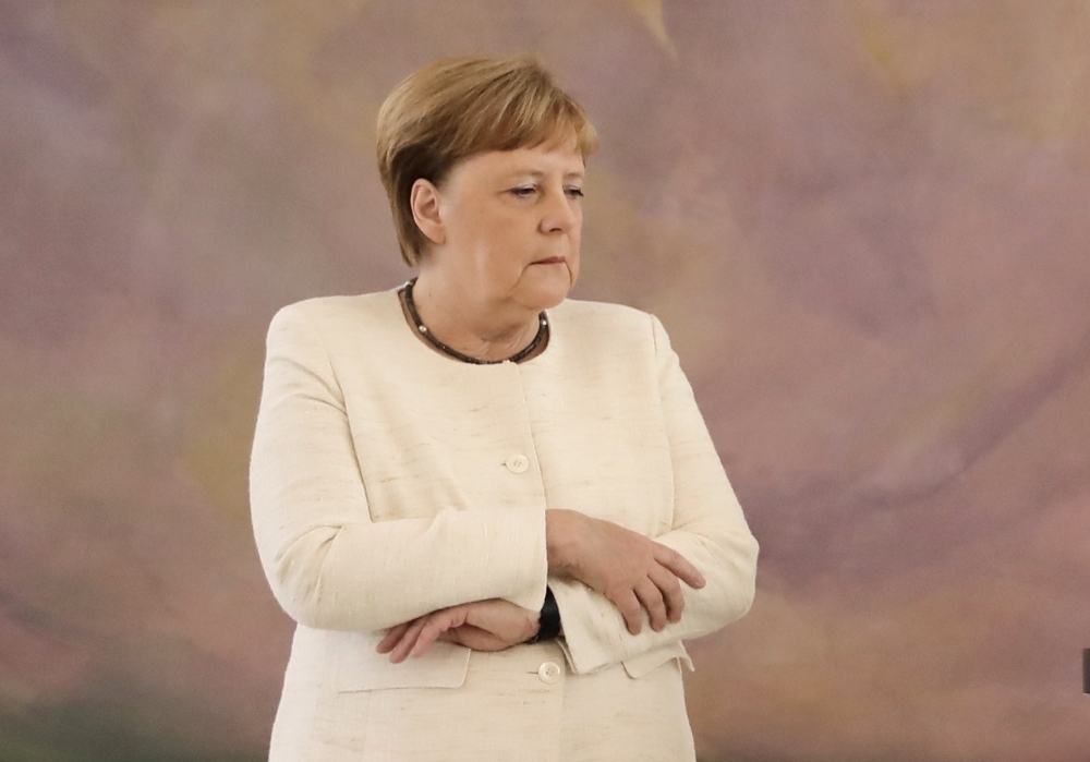 German Chancellor Angela Merkel attends a ceremony where the country's new Justice Minister was given her certificate of appointment by the German President at the presidential Bellevue Palace in Berlin on Thursday. — AFP